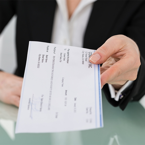 Person handing over a check