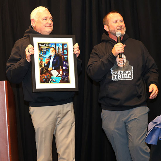 Men holding up a picture