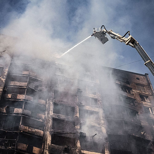 Spraying water on a burning building